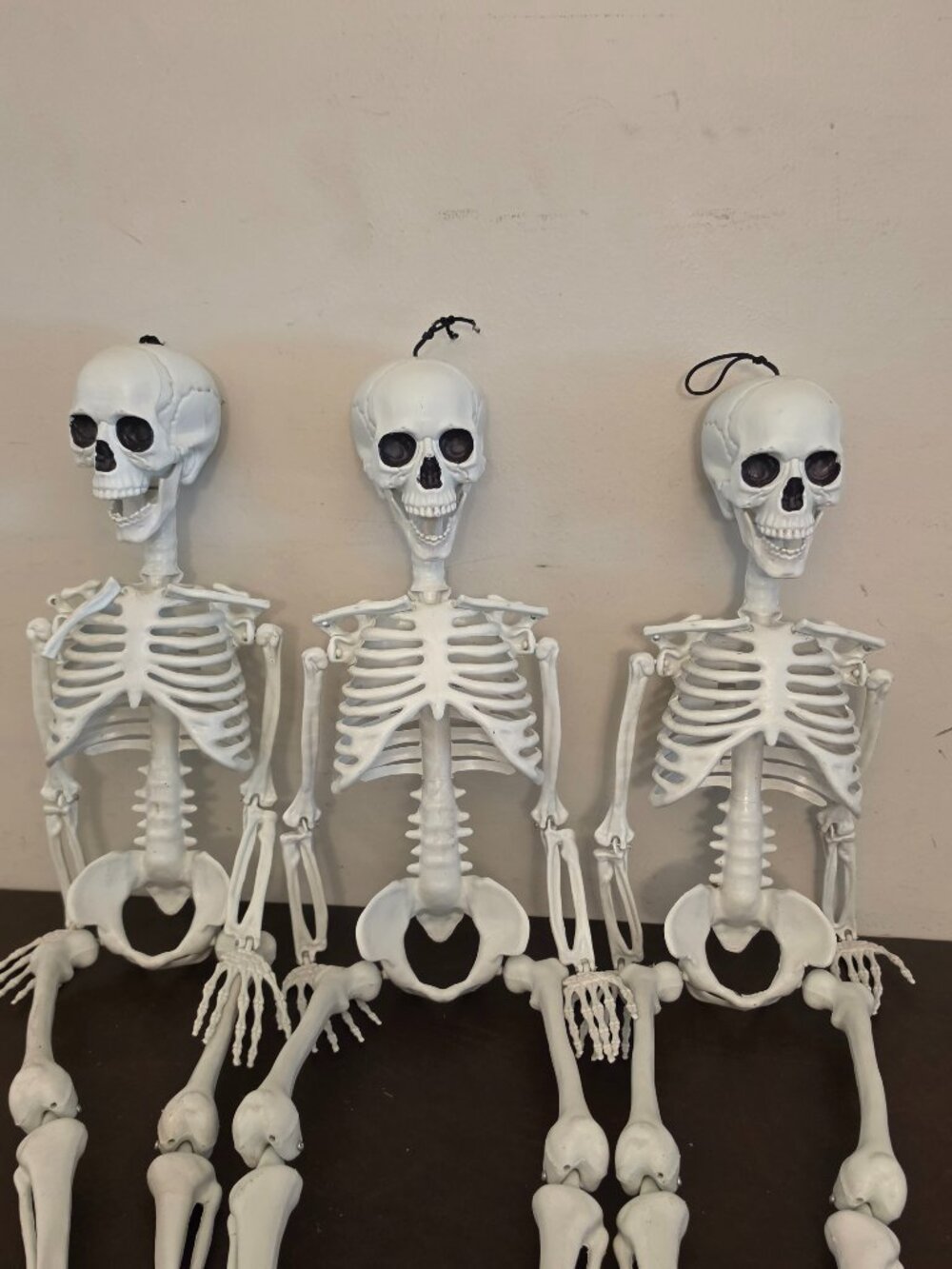 (3) pre-owned skeleton plastic Halloween decorations (34"x 7"W) Preowned